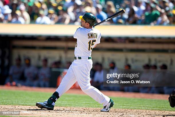 Seth Smith of the Oakland Athletics hits a three run home run against the Houston Astros during the third inning at O.co Coliseum on September 8,...