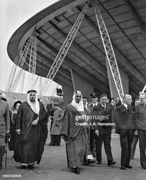 Saudi Royal Emir Faisal during a visit to the Festival of Britain, the Dome of Discovery in the background, on the South Bank in London, England,...