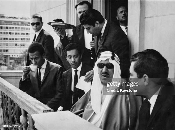 Saudi Royal Ibn Saud with some of his sons as they watch a ceremonial parade from the balcony of the Hotel Grande Bretagne, in Athens, Greece, 29th...