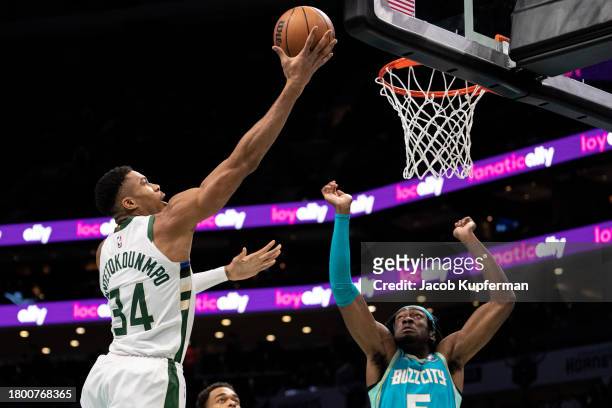 Giannis Antetokounmpo of the Milwaukee Bucks drives to the basket while guarded by Mark Williams of the Charlotte Hornets during an NBA In-Season...