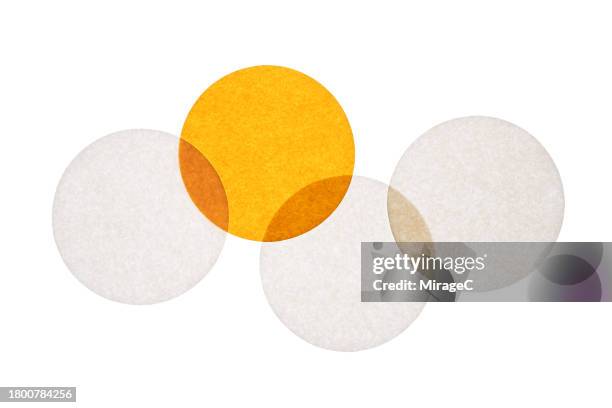 overlapping white and yellow circular paper - odd one out obscure stock pictures, royalty-free photos & images