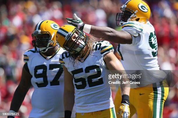 Johnny Jolly, Clay Matthews, and B.J. Raji of the Green Bay Packers react after a play during the game against the San Francisco 49ers at Candlestick...