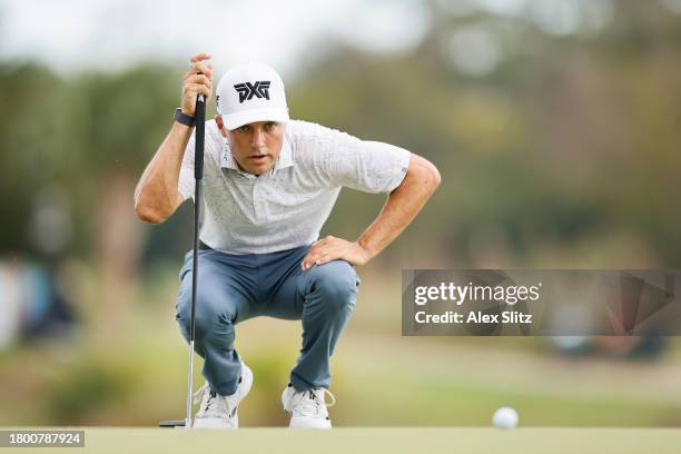 Eric Cole of the United States lines up a putt on the 13th green during the third round of The RSM Classic on the Seaside Course at Sea Island Resort...