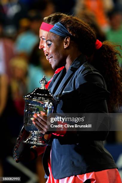 Serena Williams of the United States of America poses with the trophy after winning her women's singles final match against Victoria Azarenka of...