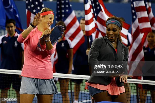Serena Williams of the United States of America and Victoria Azarenka of Belarus joke around during the trophy presentation after their women's...