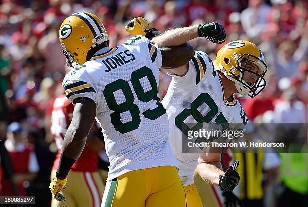 Jordy Nelson and James Jones of the Green Bay Packers celebrate after Nelson caught a six yard touchdown pass during the third quarter against the...