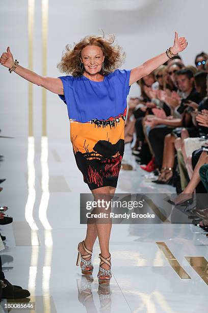 Fashion designer Diane Von Furstenberg greets the audience at the end of her fashion show> at The Theatre at Lincoln Center on September 8, 2013 in...