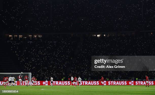 General view of play inside the stadium as fans light torches during an international friendly match between Germany and Turkey at Olympiastadion on...