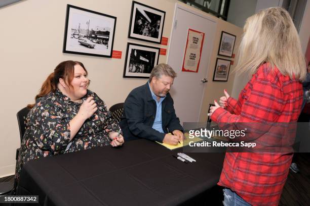 Chrissy Metz and Bradley Collins sign books at Family Time with Chrissy Metz at The GRAMMY Museum on November 18, 2023 in Los Angeles, California.