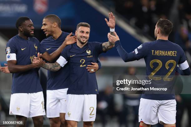 Jonathan Clauss of France celebrates with team mates after scoring to give the side a 5-0 lead during the UEFA EURO 2024 European qualifier match...