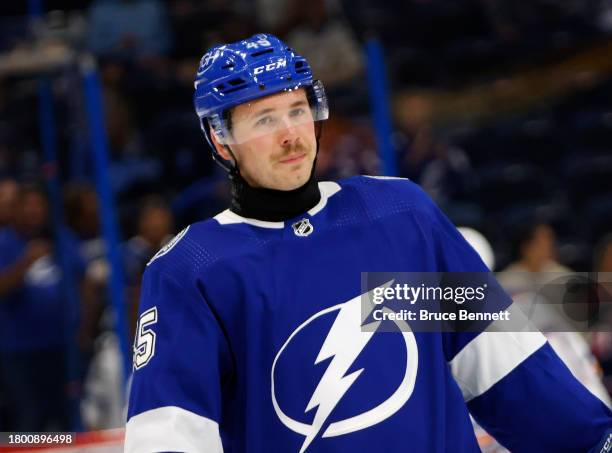 Cole Koepke of the Tampa Bay Lightning warms up prior to a game against the Edmonton Oilers while wearing a neck guard at Amalie Arena on November...