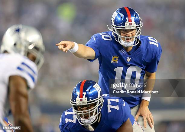 Quarterback Eli Manning of the New York Giants calls out from under center in the first quarter against the Dallas Cowboys in the first half on...