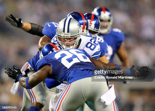 Tight end Jason Witten of the Dallas Cowboys runs after a catch against Antrel Rolle of the New York Giants in the first half on September 8, 2013 at...
