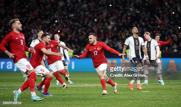 Cenk Ozkacar of Turkey celebrates after scoring the team's third goal from the penalty spot during an international friendly match between Germany...