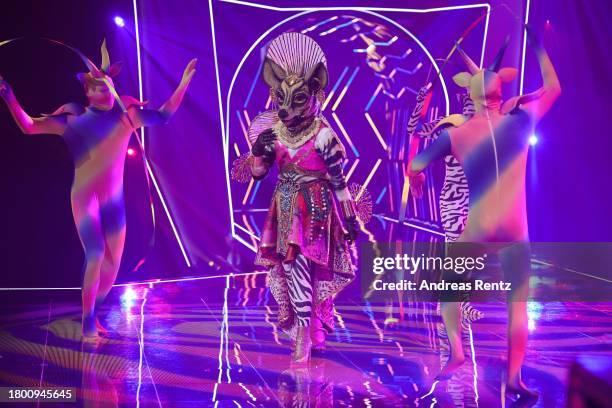 Das Okapi" performs on stage during the first showing of season 9 of "The Masked Singer" on November 18, 2023 in Cologne, Germany.