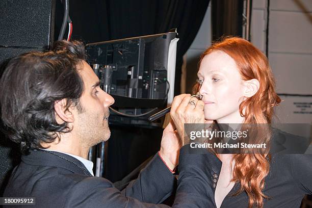 Model Karen Elson prepares backstage before the Diane Von Furstenberg show during Spring 2014 Mercedes-Benz Fashion Week at The Theatre at Lincoln...