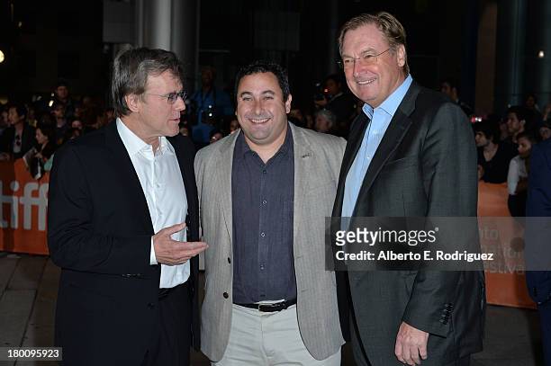 Executive producer Nigel Sinclair, producer Tobin Armbrust and executive producer Guy East attend the "Rush" premiere during the 2013 Toronto...