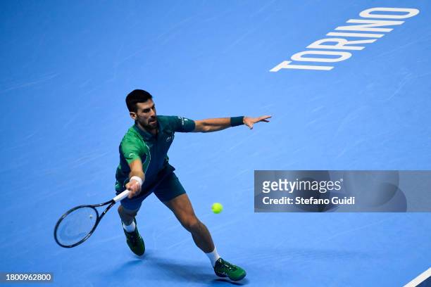 Novak Djokovic of Serbia plays a shot of Carlos Alcaraz of Spain in their Semi Finals Men's Single's Nitto ATP match during day seven of the Nitto...