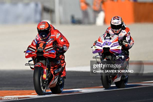 Ducati Spanish rider Jorge Martin and Ducati Italian rider Francesco Bagnaia take part in the practice session of the MotoGP Valencia Grand Prix at...