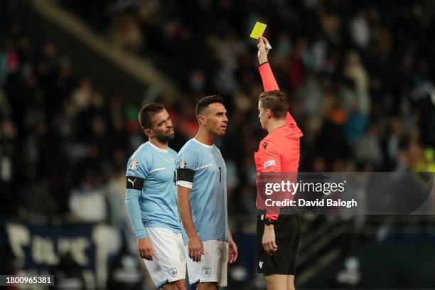 Eran Zahavi of Israel is shown a yellow card by Referee Francois Letexier during the UEFA EURO 2024 European qualifier match between Israel and...