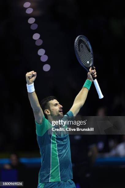 Novak Djokovic of Serbia celebrates against Carlos Alcaraz of Spain during the Men's Singles Semi Final match on day seven of the Nitto ATP Finals at...