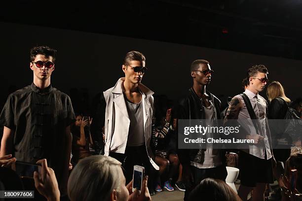 Models walk the runway at the Ricardo Seco fashion show during Mercedes-Benz Fashion Week Spring 2014 at Eyebeam Studio on September 8, 2013 in New...