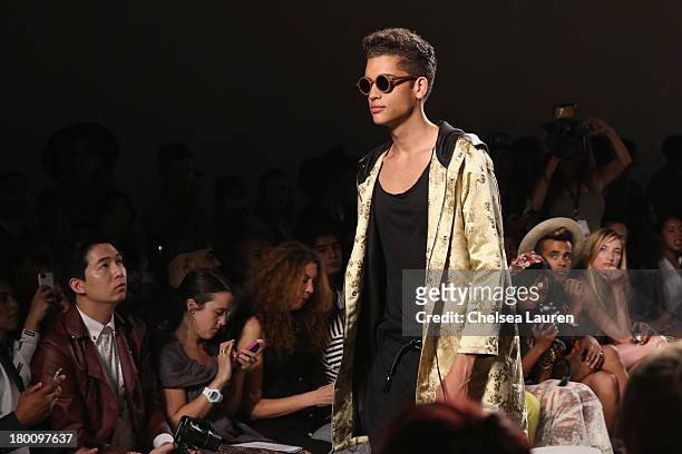 Model walks the runway at the Ricardo Seco fashion show during Mercedes-Benz Fashion Week Spring 2014 at Eyebeam Studio on September 8, 2013 in New...