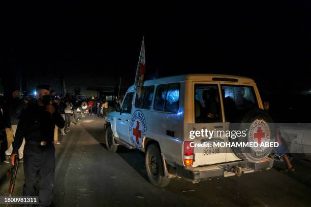 International Red Cross vehicles reportedly carrying hostages released by Hamas cross the Rafah border point in the Gaza Strip on the way to Egypt...