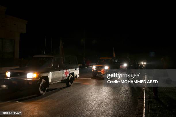 International Red Cross vehicles reportedly carrying hostages released by Hamas cross the Rafah border point in the Gaza Strip on the way to Egypt...