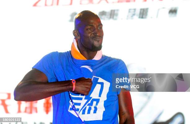 American NBA player Kevin Garnett of the Brooklyn Nets meets fans at South China Normal University on September 8, 2013 in Guangzhou, China.