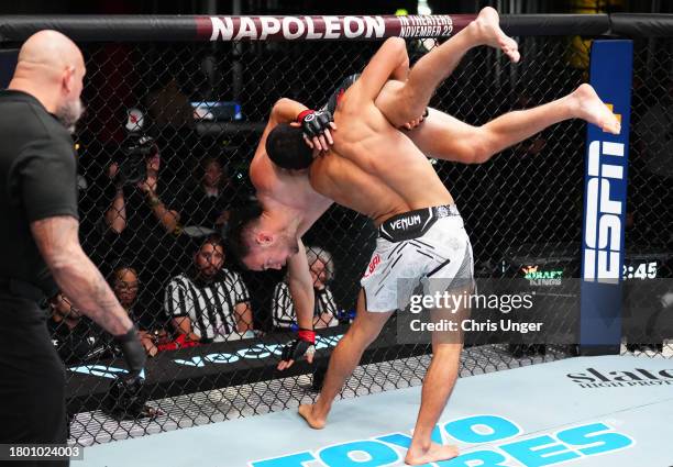 Myktybek Orolbai of Kyrgyzstan takes down Uros Medic of Serbia in a welterweight fight during the UFC Fight Night event at UFC APEX on November 18,...