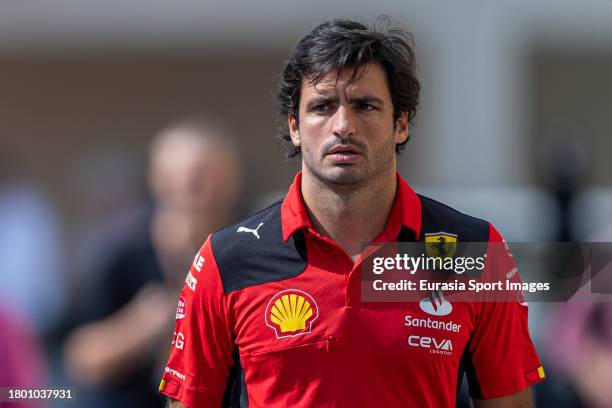 Carlos Sainz of Spain and Ferrari walks in the Paddock prior to practice ahead of the F1 Grand Prix of Abu Dhabi at Yas Marina Circuit on November...