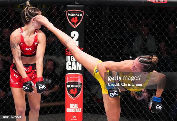 Amanda Ribas of Brazil kicks Luana Pinheiro of Brazil in a strawweight fight during the UFC Fight Night event at UFC APEX on November 18, 2023 in Las...