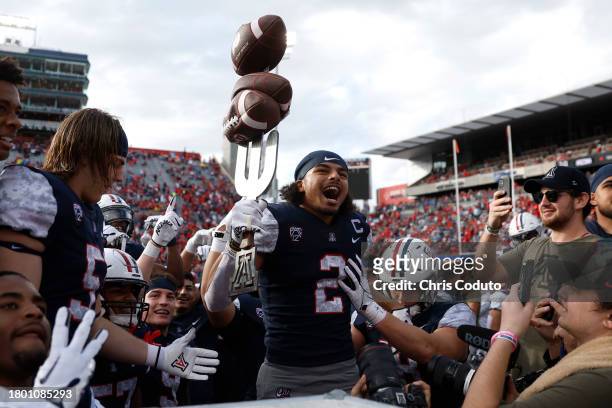Cornerback Treydan Stukes of the Arizona Wildcats celebrates on the sideline after an interception during the second half against the Utah Utes at...