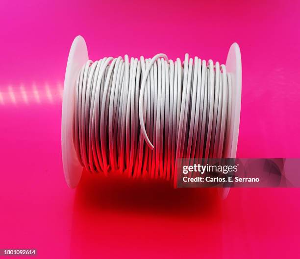 a spool of white insulated cooper wire - spool isolated stock pictures, royalty-free photos & images