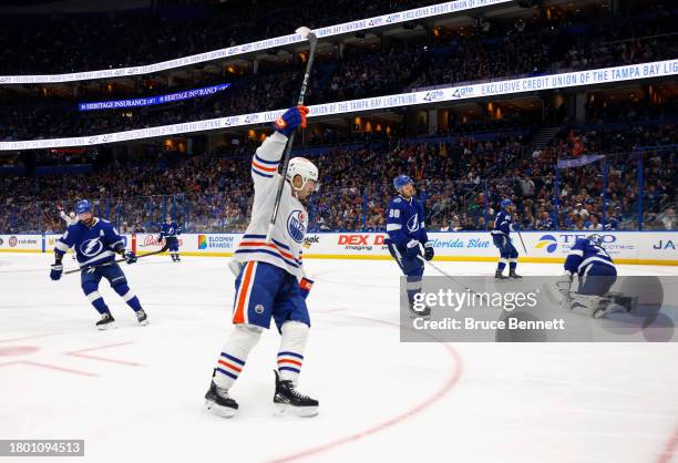 Evan Bouchard of the Edmonton Oilers scores a third period goal against the Tampa Bay Lightning at Amalie Arena on November 18, 2023 in Tampa,...
