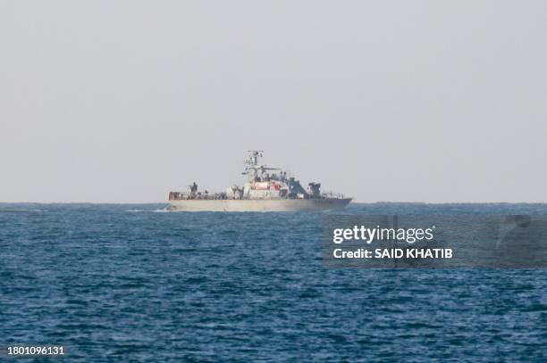 An Israeli gunboat patrols off the coast of Rafah on the southern Gaza Strip, on November 24, 2023. After 48 days of gunfire and bombardment that...