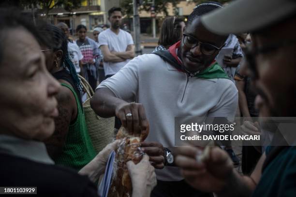 South African Jews and Pro Palestinian activists share bread as they gather at the University of Witwatersrand during a Shabbat Against the Genocide...