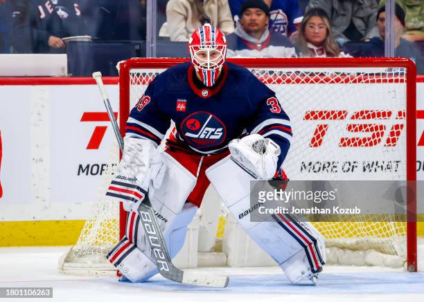Goaltender Laurent Brossoit of the Winnipeg Jets guards the net during third period action against the Arizona Coyotes at Canada Life Centre on...