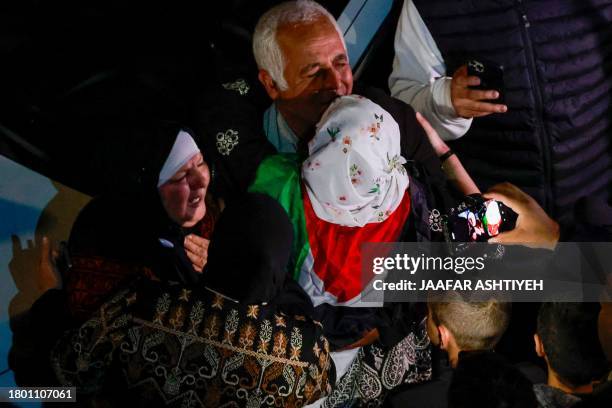 Friends and relatives of Palestinian prisoners that were released from the Israeli Ofer military facility in exchange for hostages freed by Hamas in...