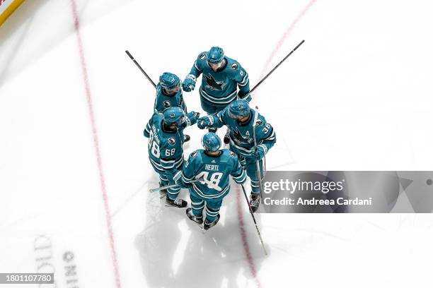 November 24: Mike Hoffman of the San Jose Sharks celebrating a goal with his teammates against the Montreal Canadiens at SAP Center on November 24,...