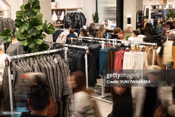 Shoppers are seen at Abercrombie & Fitch store during "Black Friday" in New York on November 24 the unofficial start of the holiday shopping season.