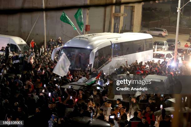 Released Palestinian prisoners, arrive to Beitunia, west of Ramallah, with International Red Cross vehicles under the agreement on the four-day...