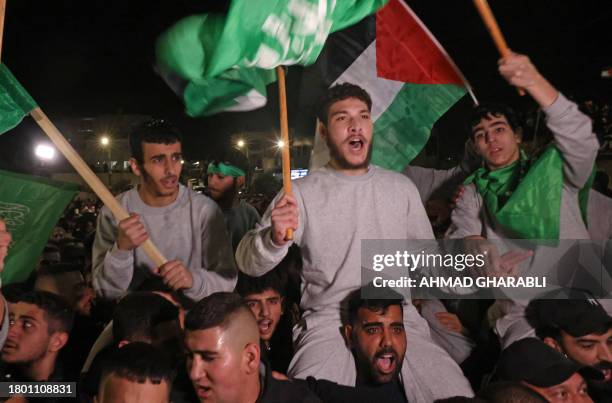 Palestinian prisoners cheer after being released from the Israeli Ofer military facility in Baytunia near the city of Ramallah in the occupied West...