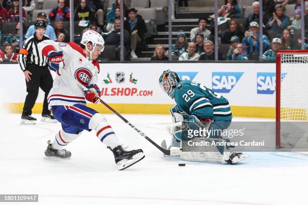 November 24: Mackenzie Blackwood of the San Jose Sharks making a save against Juraj Slafkovsky of the Montreal Canadiens in overtime at SAP Center on...