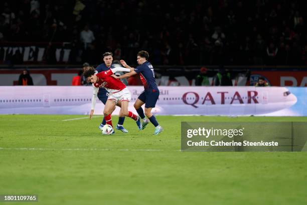 Vitinha of Paris Saint-Germain and Manuel Ugarte of Paris Saint-Germain challenge Maghnes Akliouche of AS Monaco during the Ligue 1 Uber Eats match...