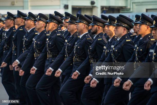 Members of the graduation class are participating in a passing-out parade at the Hong Kong Correctional Services Academy in Hong Kong, China, on...