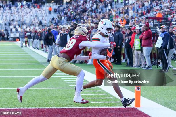 Miami Hurricanes wide receiver Jacolby George scores a touchdown against Boston College Eagles defensive back Max Tucker during the college football...