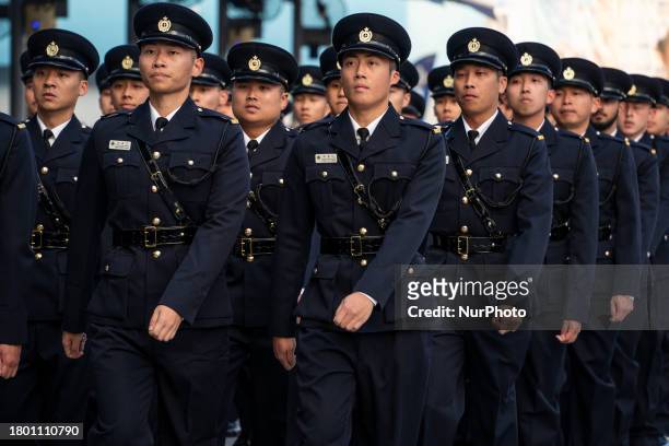 Members of the graduation class of the Hong Kong Correctional Service Department are marching during a passing-out parade at the Hong Kong...