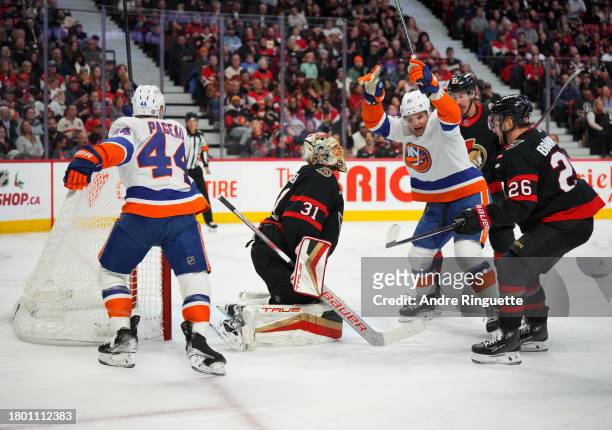 Oliver Wahlstrom of the New York Islanders celebrates his second period goal against Anton Forsberg of the Ottawa Senators with teammate Jean-Gabriel...
